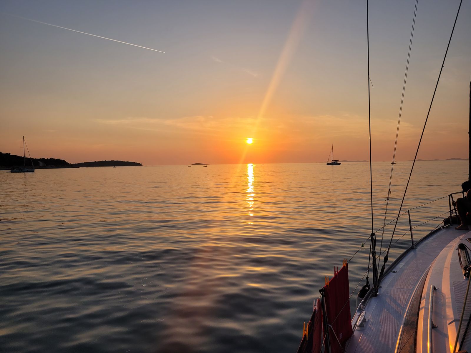 A yacht at anchor at dusk